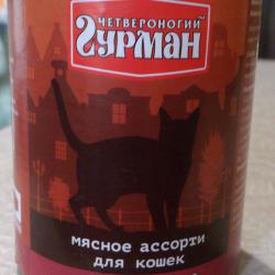 Фото консервированного корма «Четвероногий гурман» мясное ассорти с языком для кошек